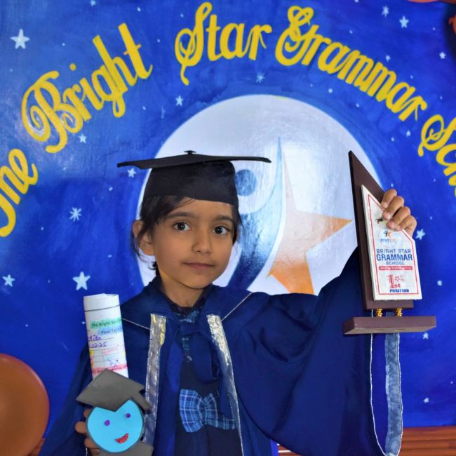 A proud graduate in cap and gown