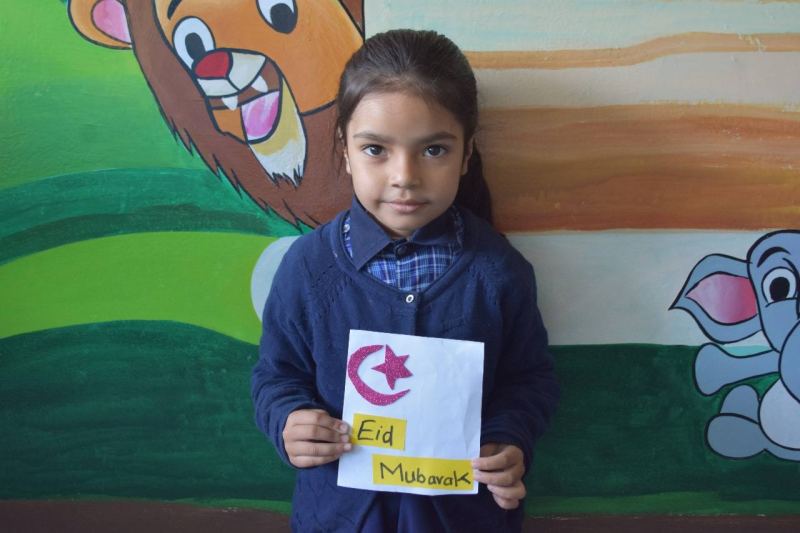 A student celebrating Eid at school