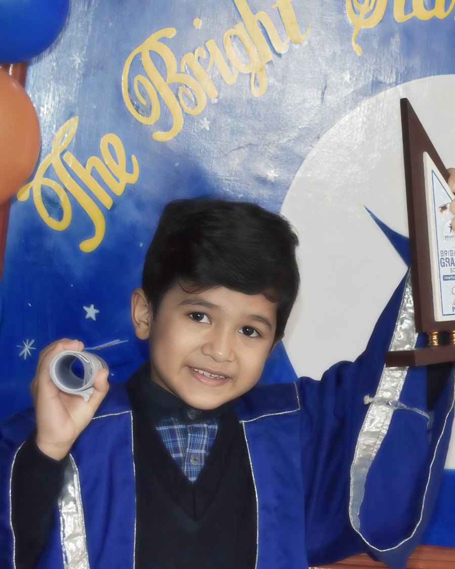 Student holding his trophy at the Bright Star award ceremony