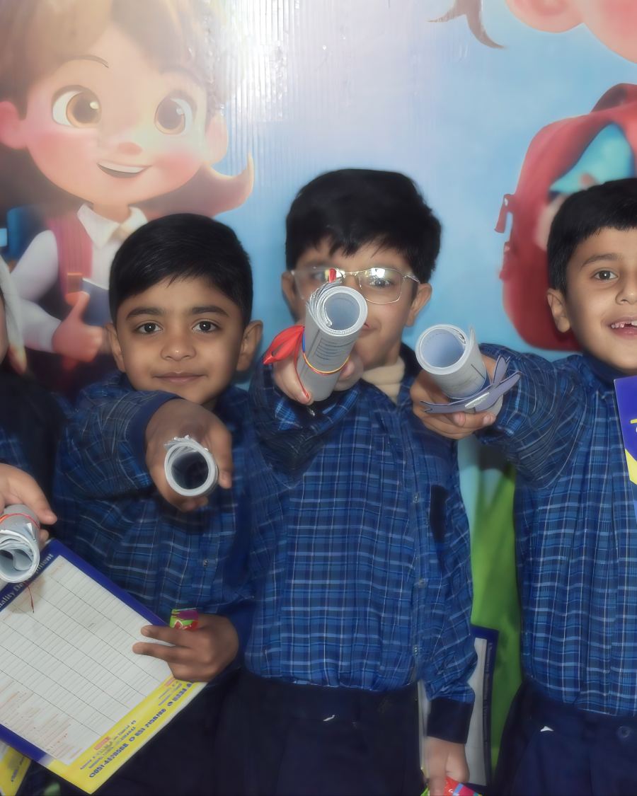 Students proudly holding their certificates